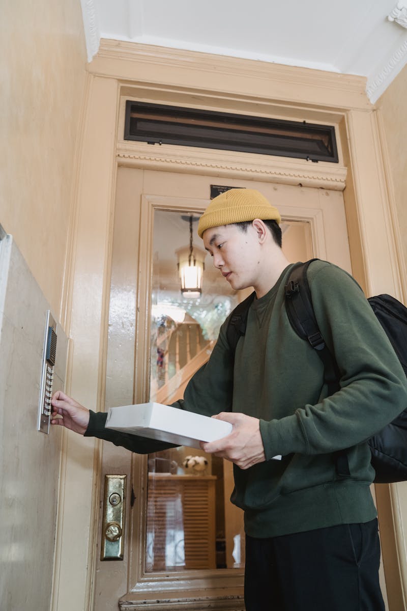 Friendly Anthony technician at a customer doorbell, approachable and professional